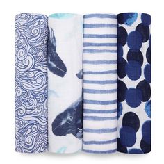 four different types of towels stacked on top of each other in various patterns and colors