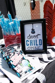 there is a sign that says sweet child o mine on it and candy bags in the background