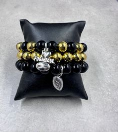 New Orleans Saints inspired handmade Football Charm Bracelets Black & Gold & White Team Colors Show off your team spirit Beautiful  All Handmade Dangling football charms Easy on and off Thank you for checking it out! *Colors may vary slightly in person than they do on your screen* Villa Rica, Colors Show, Bracelets Black, Bracelets Set, New Orleans Saints, Team Spirit, Charm Bracelets, Team Colors, Bracelet Set