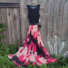 I.N.C. International Concepts Dress Nwt Size 10 Black Sleeveless Bodice With Peek-Hole Opening In The Back. Accompanied By A Beautiful Flowing Floral Skirt. The Lined Skirt Has Stylized Roses In Light And Vibrant Pink Against Black Background. The Black Fabric Sash Can Be Tied. The Top Is 95% Polyester And 5% Spandex The Bottom And Lining Are Both 100% Polyester. Chest 16.5" Waist 15" Can Be Tied Tighter With Sash Skirt Length 42" Spring Cocktail Maxi Dress With Full Skirt, Fitted Black Maxi Dress With Full Skirt, Black Fitted Maxi Dress With Full Skirt, Pink Flowy A-line Dress, Black Full Skirt Dress For Spring, Black Full Skirt Dress For Summer, Black Fit And Flare Maxi Dress For Spring, Spring Black Maxi Dress With Full Skirt, Spring Black Full Skirt Maxi Dress