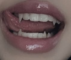 a woman's mouth with white teeth and pink lipstick