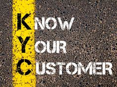 the words know your customer are written in white paint on a yellow line across an asphalt surface