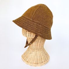 "This brown brimmed sun hat is the perfect thing for sunny summer days! Washable linen makes it an easy go to for outdoor play at the park, the beach, or even the backyard! This hat will protect delicate baby and toddler skin from the sun and will quickly become a favorite summer hat for boys and girls! I made this sun hat from a hazelnut brown colored linen to go with every outfit. The strap closes with snaps under the chin keeps them from pulling it off. Brim measures approx. 2.25 inches. HAT Brown Adjustable Bucket Hat, Adjustable Handmade Brown Cloche Hat, Adjustable Pre-washed Hat For Everyday, Adjustable Bucket Hat For Everyday, Adjustable Brown Bonnet Cap, Adjustable Brown Bucket Sun Hat, Handmade Adjustable Bonnet With Short Brim, Handmade Adjustable Short Brim Bonnet, Adjustable Pre-washed Everyday Hat