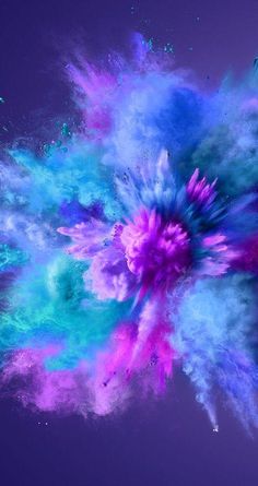 colorful powder is flying in the air on a purple and blue background with space for text