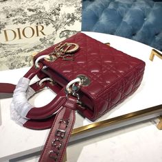 Description CHRSTN DR Small Lady DYOR My ABCDYOR Bag Cherry Red Cannage For Women 20cm/8in CD Rep 1:1 Dimensions: 20 x 17 x 8 cm / 8 x 6.5 x 3 inches The Lady DYOR My ABCDYOR bag epitomizes DYOR’s vision of elegance and beauty. Sleek and refined, the timeless style is crafted in latte lambskin with Cannage stitching, creating the instantly recognizable quilted texture. Pale gold-finish metal ‘D.I.O.R.’ charms further embellish its silhouette with an elegant allure. Featuring a shoulder strap tha Lady Dior My Abcdior Bag, Dior And I, Small Lady, Stylish Handbags, Color Cafe, Luxury Products, Pale Gold, Evening Clutch Bag, The Lady