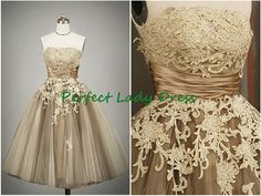 the dress is made up of tulle and has an appliques on it