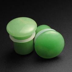 Type: Flesh Plug  Stone: Green Aventurine Flare Style: Single Flare  Face Style: Convex Availability: 3mm -16mm Check out these beautifully polished single flare plugs in green aventurine stone. These pretty green plugs are made with our classic convexed single flare style.  Handcrafted and polished to a glass-like finish, these plugs have a large convex face. The wearable area on these plugs is also a little longer than usual making these suitable for other stretched areas besides the ear lobe. Green Aventurine Stone, Face Style, Stretched Lobes, Stone Plugs, Aventurine Stone, Organic Jewelry, Ring Der O, Blue Tigers Eye, Gauged Earrings