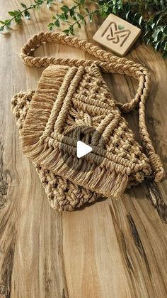 a woven bag sitting on top of a wooden table