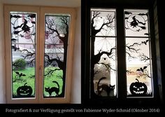 two windows with halloween decorations on them