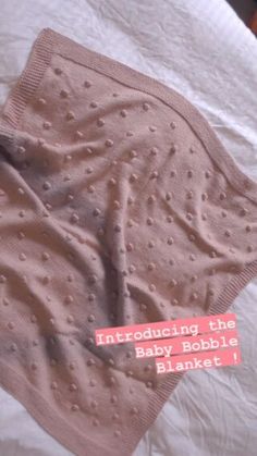 an unmade baby blanket with the words, including the baby bobbi blank label