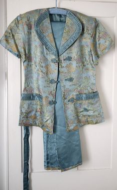 Luxurious 1930s Chinese silk brocade pyjama suit, in beautiful shade of teal with brocade trim to pants, fitted jacket tied with sash and fully lined in the teal/turquoise silk, with pleated detailing to pockets and collar. Immaculate condition, unworn. length of pants from waistband to hem c.93cms. waist c.50cms. with elasticated part which could be adjusted to fit. shoulder to shouder c.40.5cms. ( shoulders padded). c.65cms from top to hem armpit to armpit c.49cms. across waist or hips c.50 cm Ladybug Redesign, Pyjama Suit, 1930s Men, Womens Lingerie, Chinese Silk, Pajama Suit, Fitted Jacket, Shades Of Teal, Teal Turquoise