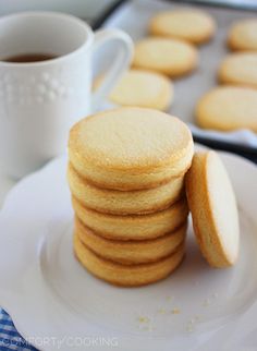 a stack of cookies sitting on top of a white plate