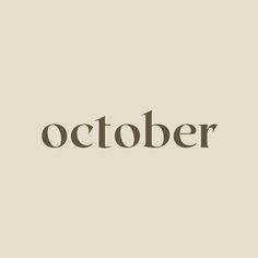 the word october written in brown on a beige background