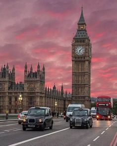 the big ben clock tower towering over the city of london, england at sunset or dawn