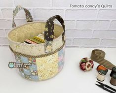 a sewing basket sitting on top of a white table