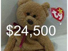 a brown teddy bear sitting on top of a white table next to a price tag