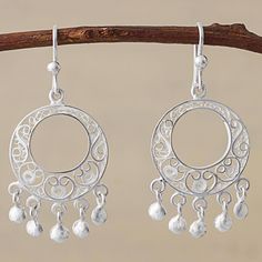 Characterized by a fusion between pre-Colombian and Moorish styles of design filigree silver work features a handcrafted process where threads of sparkling silver are formed to create delicate ornate motifs. This pair of chandelier earrings from Peru is designed by Alfredo Inga featuring elegant filigree work in silver with dangling baubles. Silver Baubles, Silver Chandelier Earrings, Filigree Bracelet, Silver Chandelier, Filigree Jewelry, Filigree Earrings, Sterling Silver Filigree, Silver Work, Rhinestone Jewelry