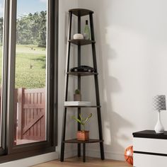 a corner shelf in the corner of a room next to a window with an open door