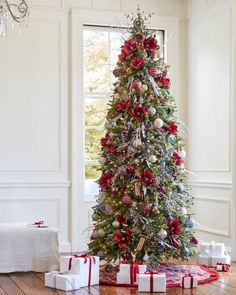 a decorated christmas tree with presents under it