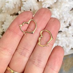 14KT yellow gold open heart hoop earrings. We carry 3 sizes of the yellow gold heart hoops- these are the smallest size. Also available in 10KT yellow gold. Measures: 16mm x 13mm Width: 2mm Weight: .46g Hollow Saint Jewelry, Polished Style, Heart Hoop Earrings, Hoop Design, Basic Design, Earrings Small, Fabric Ribbon, Open Heart, Gold Polish