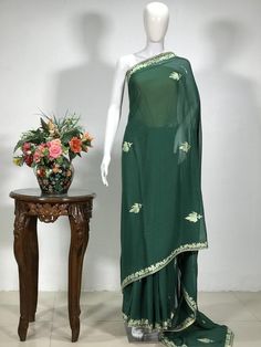 A Marvellous Embroidered Kashmiri Saree which you can wear at any party or a wedding.- - - - - - - - - - - - - - - - - - - - Product Details- Condition: Brand New (made to order)- Style: Sari- Embroidery: Kashmiri Aari and Tilla fusion Embroidery.- Base Colour: Bottle Green- Embroidery Colour: Pink & Dull Gold- Care Instructions: Dry Clean OnlyF A B R I CSaree: Viscose GeorgetteBlouse: Indian CrepeF I N I S H- UnstitchedYou can get it stitched locally.- StitchedWant your blouse ready to wear Indian Graduation, Sari Embroidery, Kashmiri Saree, Bohemian Jackets, Green Embroidery, Summer Coats, Traditional Outfit, Outfit Wedding, Wedding Sarees