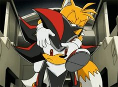 an animated image of tails hugging each other