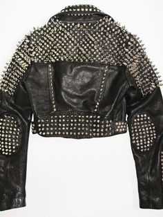 Luxury Studded Biker Jacket, Luxury Studded Outerwear For Party, Luxury Black Studded Biker Jacket, Luxury Studded Rock Biker Jacket, Luxury Moto Leather Jacket For Men, Luxury Punk Style Biker Jacket With Rivets, Luxury Studded Leather Jacket For Alternative Fashion, Luxury Studded Leather Jacket For Biker Events, Luxury Edgy Studded Outerwear