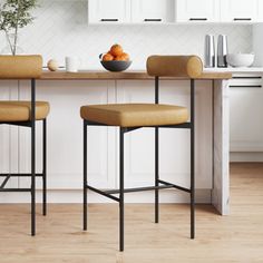 This metal barstool with a back features a comfortable cushioned seat with a cushioned back that's covered in low-maintenance vegan leather or premium polyester fabric for the ultimate bar stool experience. The modern chair has wire frame legs inspired by mid-century design and will provide an effortless touch to your kitchen or dining area. The cushion counter height chair has a slim profile to keep your space light and airy, while the matte black frame draws the eye to its durable footrest and Nathan James, Stools For Kitchen Island, Bar Stools With Backs, Backless Bar Stools, Counter Height Chairs, Stools With Backs, Austin Design, Metal Bar Stools, Counter Height Bar Stools