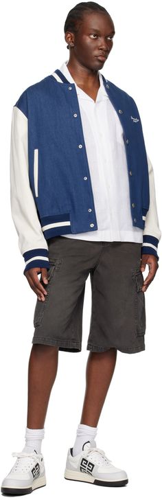 Non-stretch denim bomber jacket. · Stripes at rib knit stand collar, hem, and cuffs · Press-stud closure · Logo embroidered at chest · Welt pockets · Herringbone pattern at sleeves · Welt pockets at interior · Full plain-woven cotton and cupro lining · Logo-engraved silver-tone hardware Supplier color: Blue/White Fitted Cotton Varsity Jacket For Spring, Navy Varsity Jacket For Spring, Fitted Varsity Jacket With Ribbed Cuffs And Baseball Collar, Casual Cotton Varsity Jacket With Striped Cuffs, Fitted Varsity Jacket With Ribbed Cuffs For Streetwear, Blue Cotton Varsity Jacket For Spring, Spring Blue Cotton Varsity Jacket, Casual Fitted Varsity Jacket With Baseball Collar, Cotton Outerwear With Striped Cuffs For Streetwear