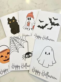 four halloween cards with black and white images