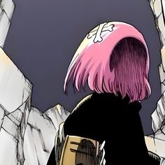 a person with pink hair standing in front of some rocks