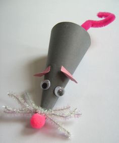 a gray paper mouse with pink ears and eyes