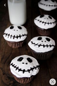 halloween cupcakes with white frosting and black sprinkles