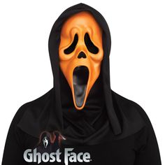 a man in a black hoodie with an orange mask on his face and mouth