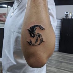 a man with a dragon tattoo on his arm