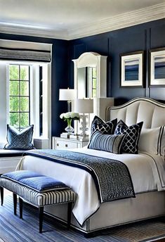 a bedroom with blue walls and white furniture