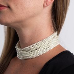 Product Description: Nothing quite expresses elegance like a strands of pearls. Take it to the next level with this choker style necklace comprised of 12 striking rows of 4mm pearls with silver and crystal bar ends wrapped around your neckline. Dimensions: 12-16" long ﻿Style Number: ﻿8391DC12P Choker Style Necklace, Pearl Choker Necklace, Choker Style, Long Style, Pearl Choker, Kenneth Jay Lane, Style Necklace, Silver Pearls, Next Level