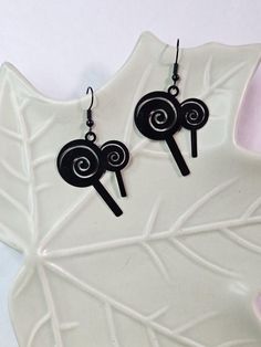 The iconic candy, the lollipop! These lollipop charms are very light weight and made with a black finish. Wire hook earrings are hypoallergenic stainless steel with a black finish. Fun Black Earrings, Fun Black Hypoallergenic Earrings, Black Hypoallergenic Fun Earrings, Etsy Earrings Dangle, Hook Earrings, Lollipop, Jewelry Earrings Dangle, Dangle Drop Earrings, Dangle Earrings