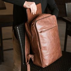 Introducing The Urban Voyager Backpack, a modern reimagining of the classic briefcase, designed to blend style and functionality effortlessly. Crafted from premium full-grain leather, this sleek backpack is perfect for the contemporary professional or traveler. With dedicated compartments for your laptop, documents, and essentials, it offers both convenience and security on the go. Whether you're commuting to work or setting out on a new adventure, The Urban Voyager ensures you do so with a touc Luxury Leather Business Backpack With Main Compartment, Luxury Business Leather Backpack With Luggage Sleeve, Luxury Office Backpack Briefcase, Luxury Leather Backpack With Laptop Compartment For Business Trips, Brown Leather Office, Leather Backpack For Men, Work Backpack, Leather Laptop Backpack, Personalized Backpack