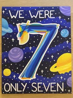 a painting with the number seven on it and planets in the background that says, we were 7 only seven