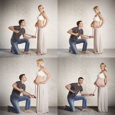 a pregnant woman is holding a man's belly while he sits on the floor