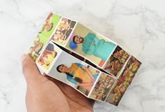 a person holding up some pictures with their hands on top of each other in front of a marble surface