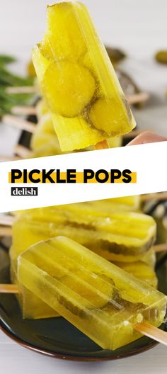 pickle pops on a plate with toothpicks sticking out of them and the words pickle pops above it