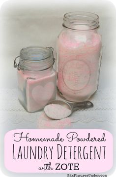 two jars filled with pink colored liquid next to a spoon on a white table cloth and the words homemade powdered laundry deterant with zote