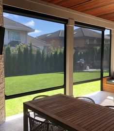 an outdoor living room with sliding glass doors