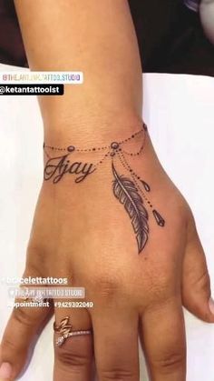 a woman's hand with a tattoo on it that says stay and an arrow