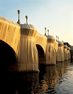 an image of a bridge that looks like it is floating in the water