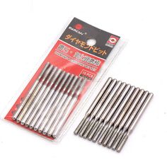 10 pieces of stainless steel drilling needles in package with plastic packaging on white background