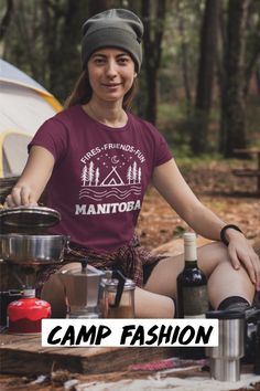 Introducing our exclusive camping t-shirt featuring a camping scene and the catchy slogan "Manitoba - Fires, Friends, Fun." This shirt is a must-have for any outdoor enthusiast looking to embrace the spirit of adventure and camaraderie. The design captures the essence of Manitoba's wilderness with its intricate depiction of a serene natural Camping setting. Catchy Slogans, Camp Vibes, Outdoor Enthusiast, Camping Fun