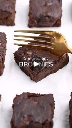 chocolate brownies on a white plate with a gold fork and video title in the middle